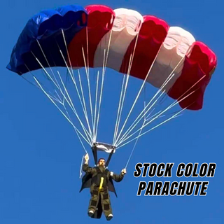 RC skydiver flying under a USA flag nylon parachute.