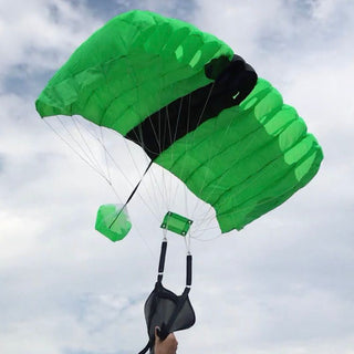 Toy green mini parachute wing kite.