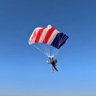 USA Parachute flying in the blue sky.