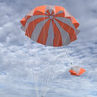 Nasa orange and white round parachute toy for rockets.