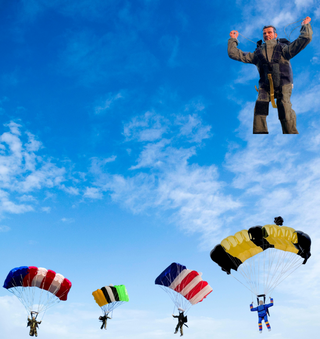 Parachutes in the blue sky.