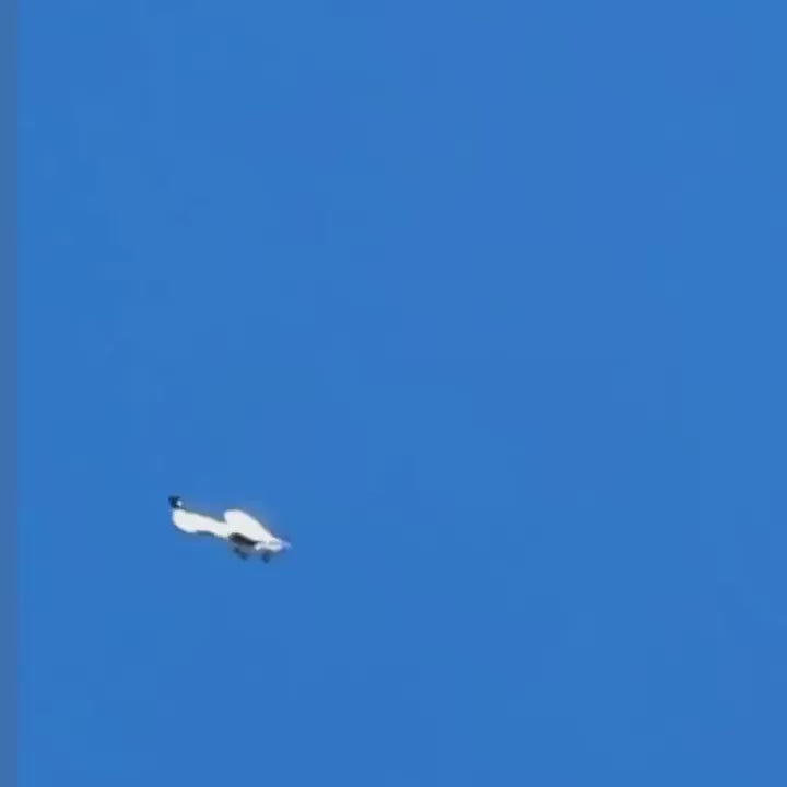 Mini skydiver falling off an rc plane and deploying his parachute.