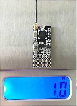 4 channel mini receiver fs2a weight on a scale.