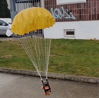 Round mini parachute toy for scale model rockets.