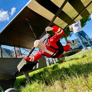 RC skydiver under rc plane wing.